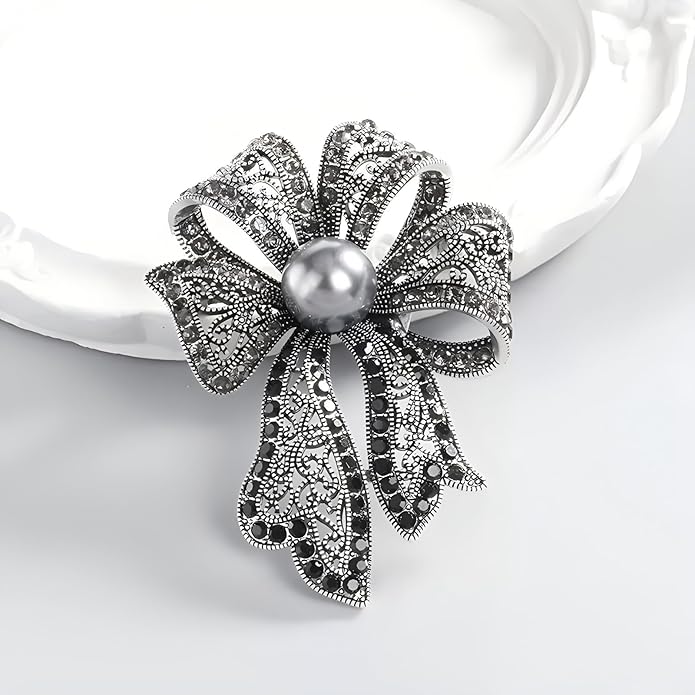 Elegant Vintage Silver Metal Bowtie Brooch with Black Pearl Accent - A Timeless Treasure for Every Occasion