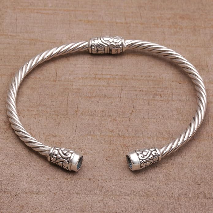 NOVICA Artisan Crafted Sterling Silver Blue Topaz Cuff Bracelet | Faceted Stone | Adjustable Cuff Design | Hypoallergenic Jewelry | Lead & Nickel Free | Indonesia ' Spiral Temple' 6 in. L (end to end)