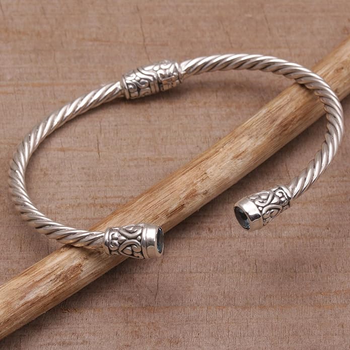 NOVICA Artisan Crafted Sterling Silver Blue Topaz Cuff Bracelet | Faceted Stone | Adjustable Cuff Design | Hypoallergenic Jewelry | Lead & Nickel Free | Indonesia ' Spiral Temple' 6 in. L (end to end)
